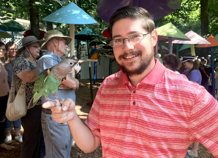 Holding a Cape Parrot at Parrot Mountain
